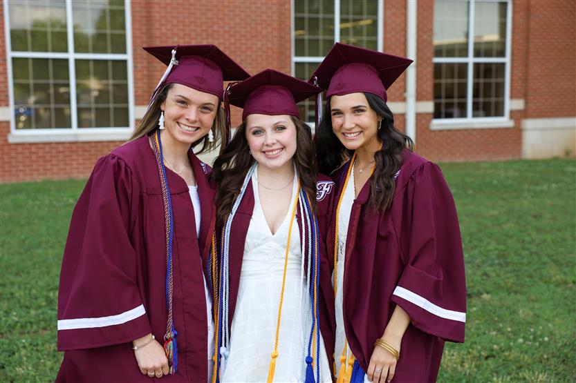 Graduates wearing maroon robes